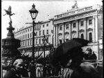 Watch Leisurely Pedestrians, Open Topped Buses and Hansom Cabs with Trotting Horses Niter